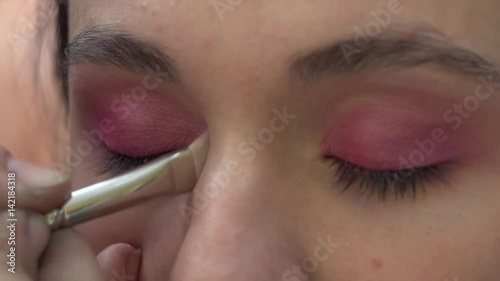 Pink Eye make-up Stock Footage. Model: Mary