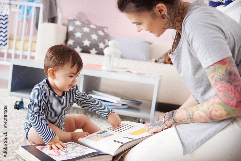 Mother helping son to discover the world Mother helping son to discover the world