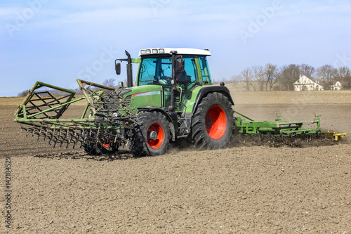 Farmer prepares the field for sowing in springtime.