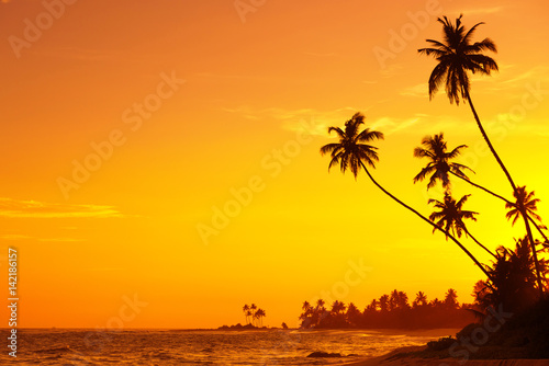 Sunset on empty tropical beach