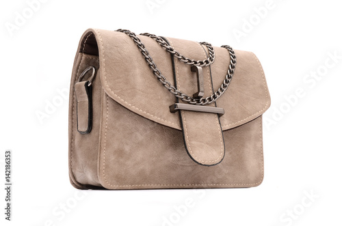 Beige leather clutch with chain isolated on white