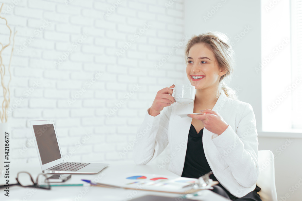 Portrait of beautiful young woman working in the office. Portrait of beautiful young woman working in the office.
