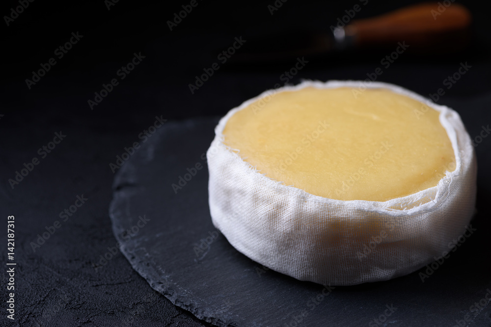Butter soft creamy sheep cheese from Seia region Portugal on slate board Butter soft creamy sheep cheese from Seia region Portugal on slate board