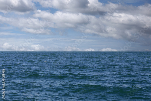 Sea wave and blue sky background. © meepoohyaphoto