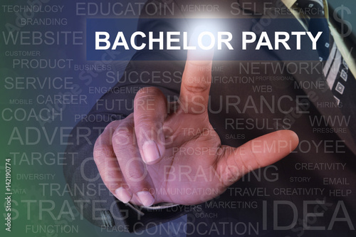 Businessman touching bachelor party button on virtual screen