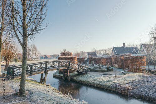 Beautiful garden and brisge cover with frost photo