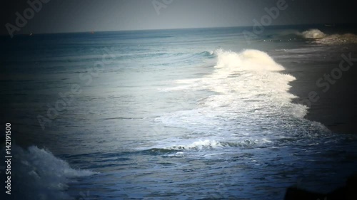 Ocean coast with waves and rocks photo