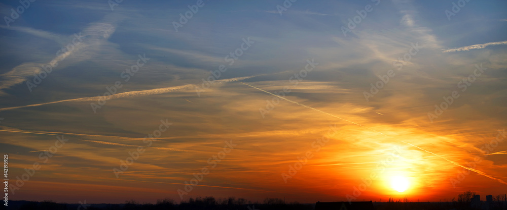 Bright colorful sunset with clouds on the horizon