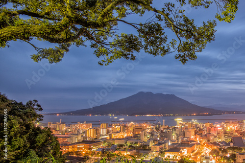 Twilight Sakurajima Volcano and Kagoshima City View from Shiroyama Viewpoint, Yakushima Island, Kyushu, Japan photo
