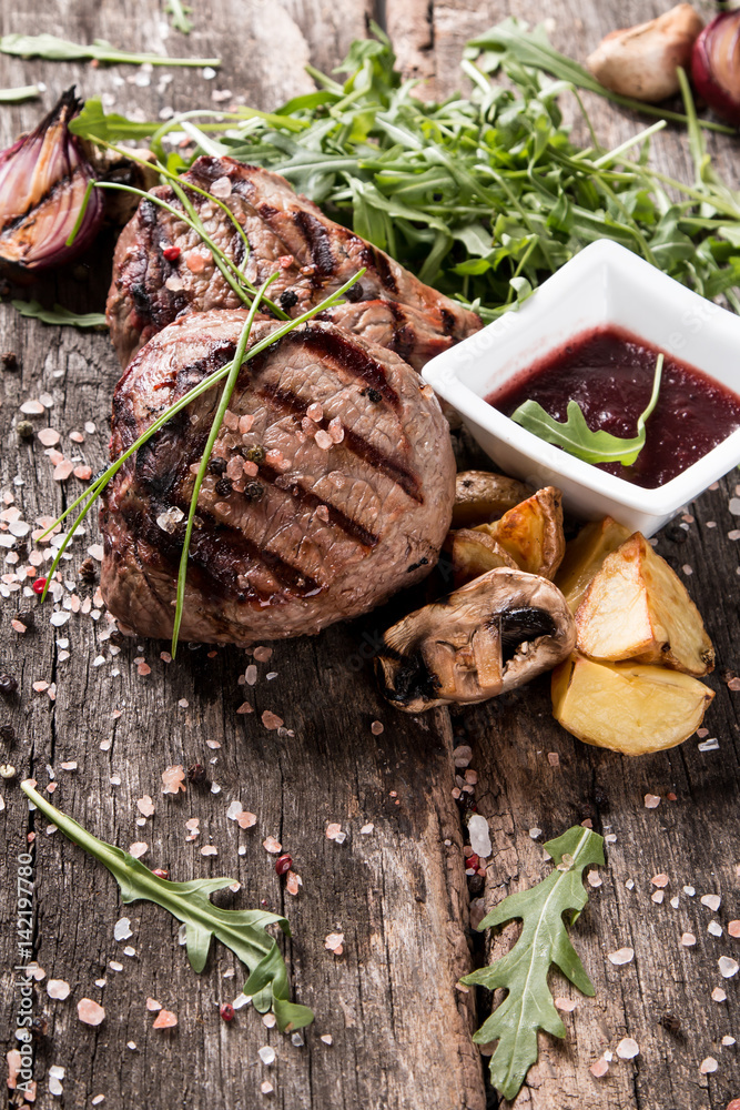 Beef steak on woode table, Fresh grilled steak with vegetable Beef steak on woode table, Fresh grilled steak with vegetable