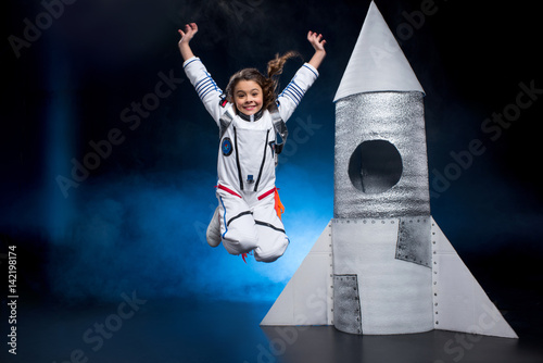 Girl in astronaut costume photo