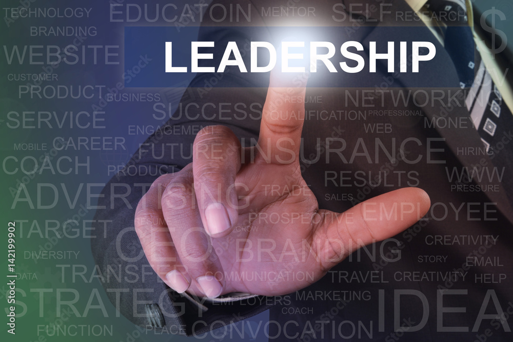 Businessman touching leadership button on virtual screen Businessman touching leadership button on virtual screen