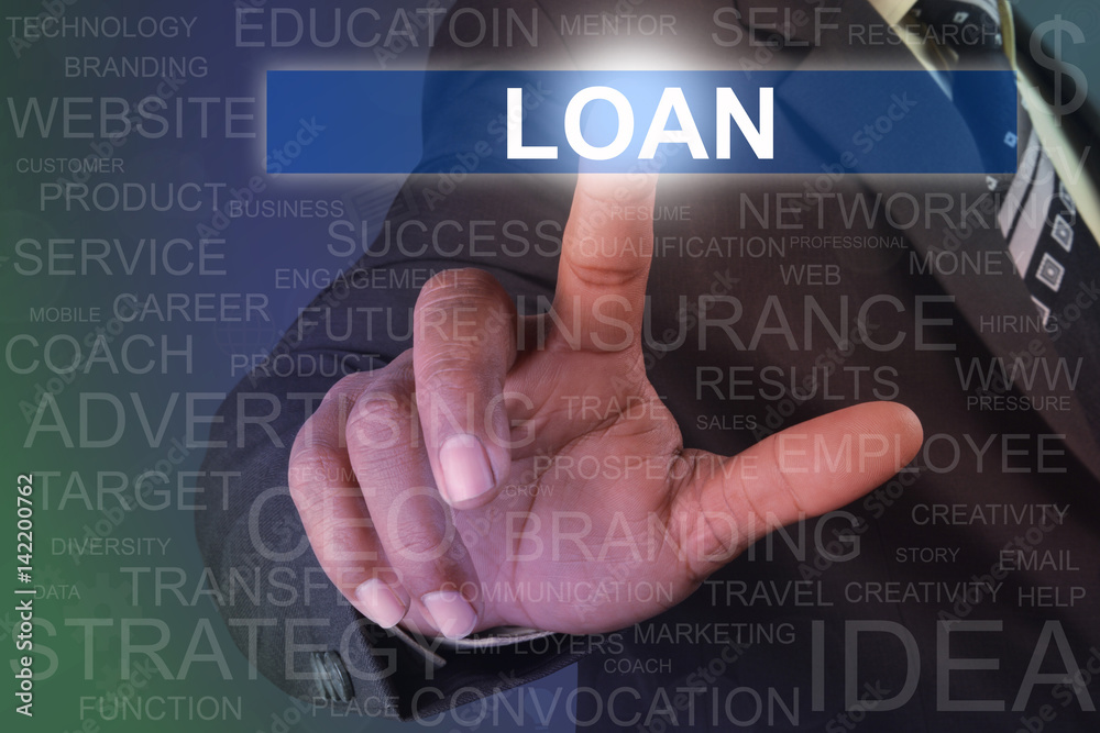 Businessman touching loan button on virtual screen Businessman touching loan button on virtual screen