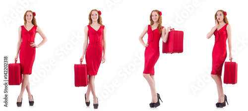 Young woman in red dress with suitcase isolated on white