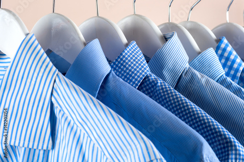 Cloth Hangers with Shirts. Men's clothes