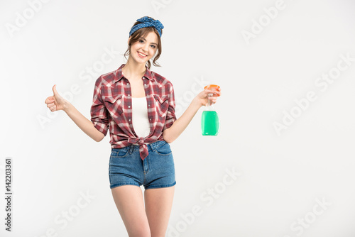 Young woman with spray bottle