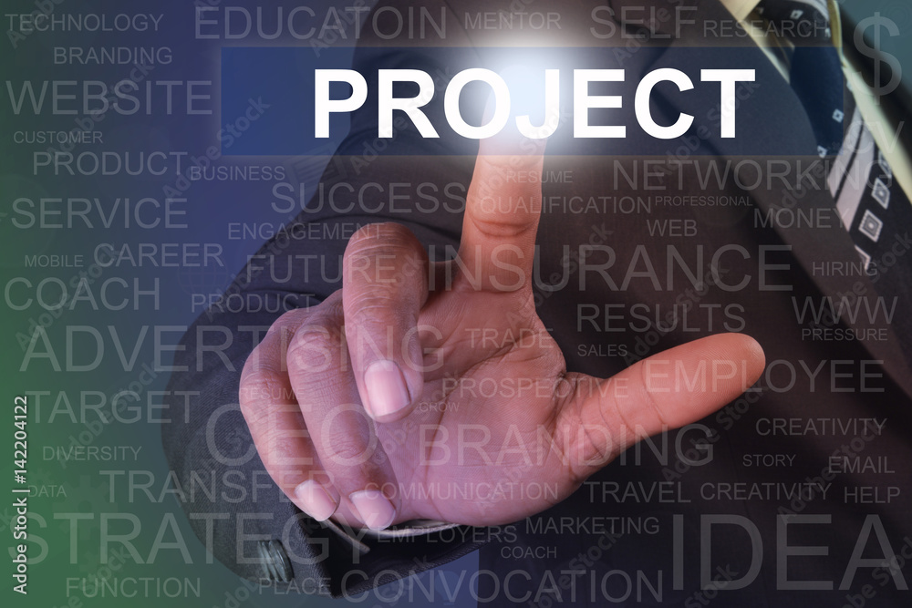 Businessman touching project button on virtual screen Businessman touching project button on virtual screen