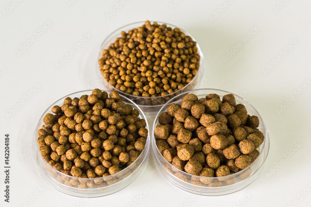 Fish feed isolated background Fish feed isolated background