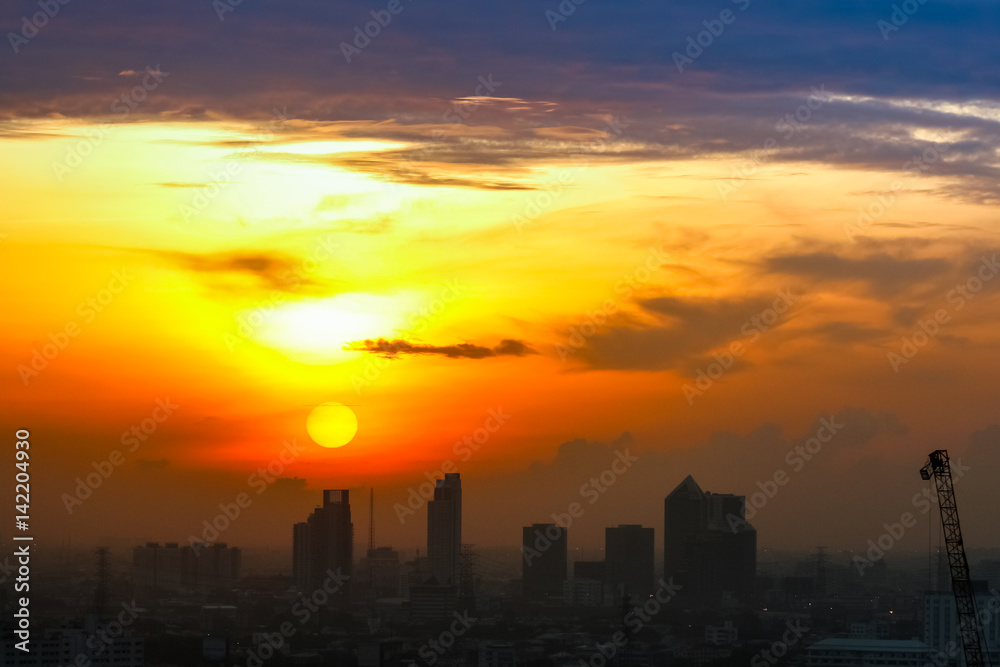 Sunrise sunset in the city with selective focus on the sun Sunrise sunset in the city with selective focus on the sun