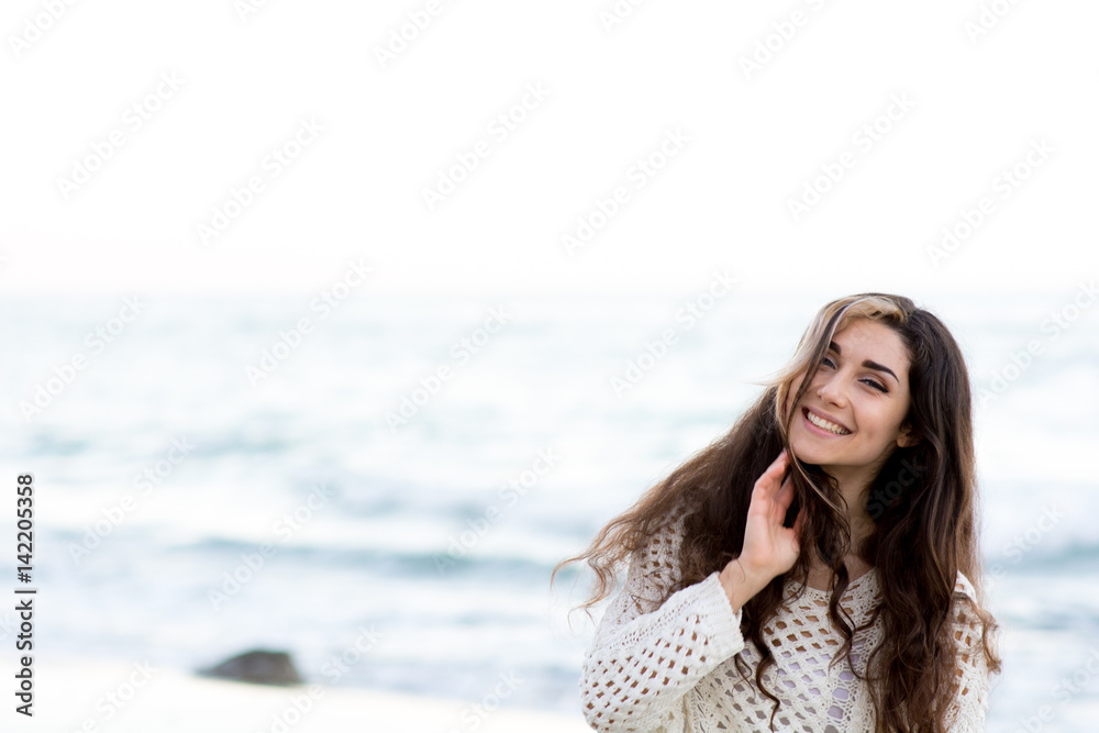 Woman with perfect hair near the beach
