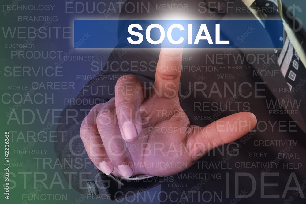 Businessman touching SOCIAL button on virtual screen Businessman touching SOCIAL button on virtual screen