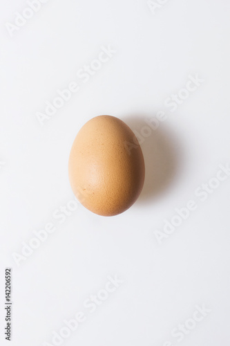 Single chicken egg isolated on white