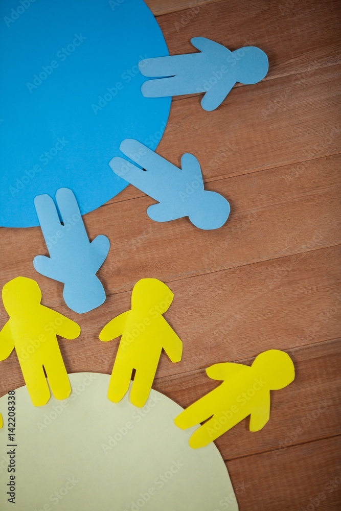 Obraz premium Blue and yellow paper cut-out people on the circle