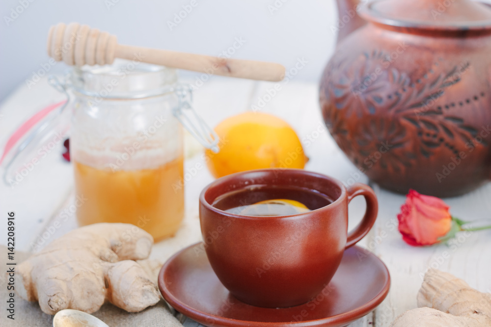 Nice ginger tea on white wooden surface. Nice ginger tea on white wooden surface.
