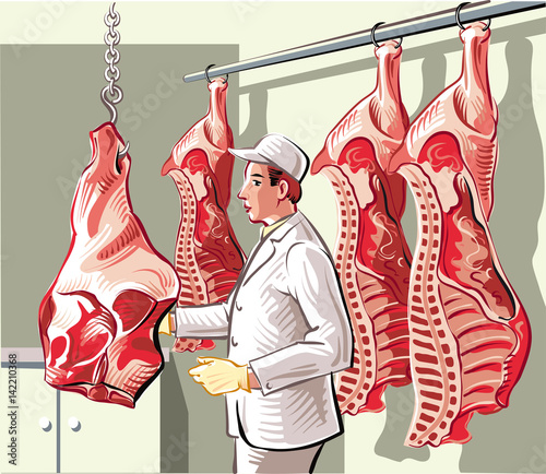 Butcher in a slaughterhouse, divides a side of beef in pieces of meat.
