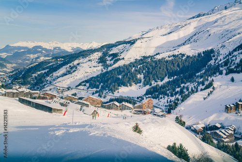 Panorama view of the Ski resort in mountains. Alpine village. Rest in mountains in the winter. Skiing and snowboards. Retro toning