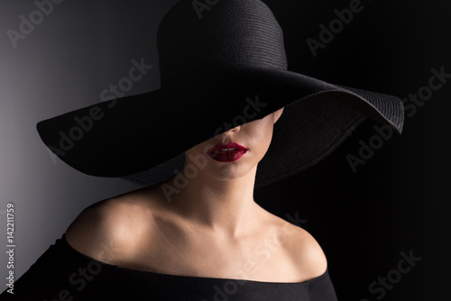 woman in black hat photo