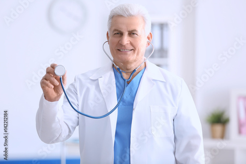 Doctor with stethoscope on ...