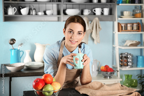 Young woman with cup of cof...