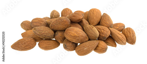 Small pile of raw natural almonds isolated on a white background.