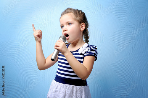 Cute little girl with micro...