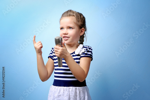 Cute little girl with micro...