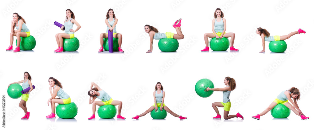Fototapeta premium Young woman with ball exercising on white