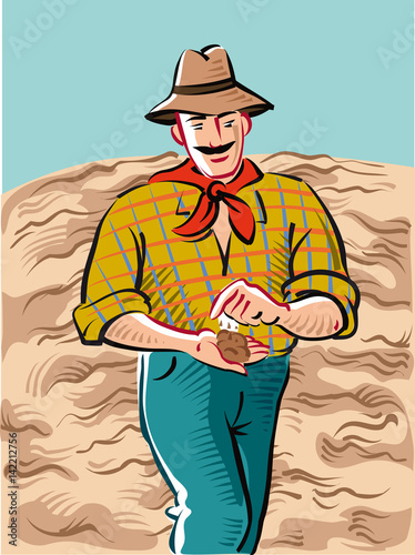 Farmer goes through his field just plowed and ready for planting.