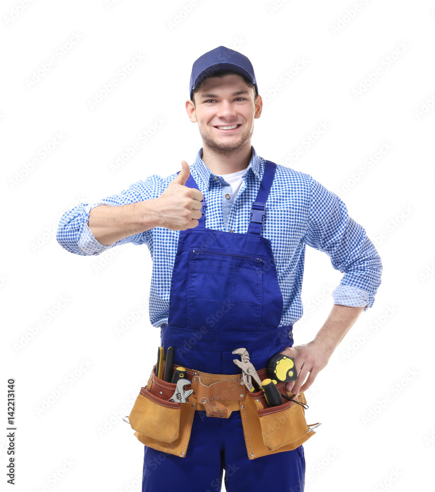 Young handsome plumber isolated on white