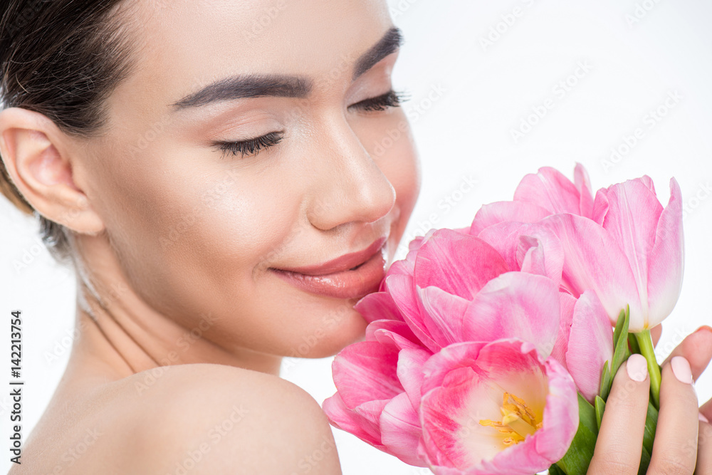 Woman with pink tulips bouquet