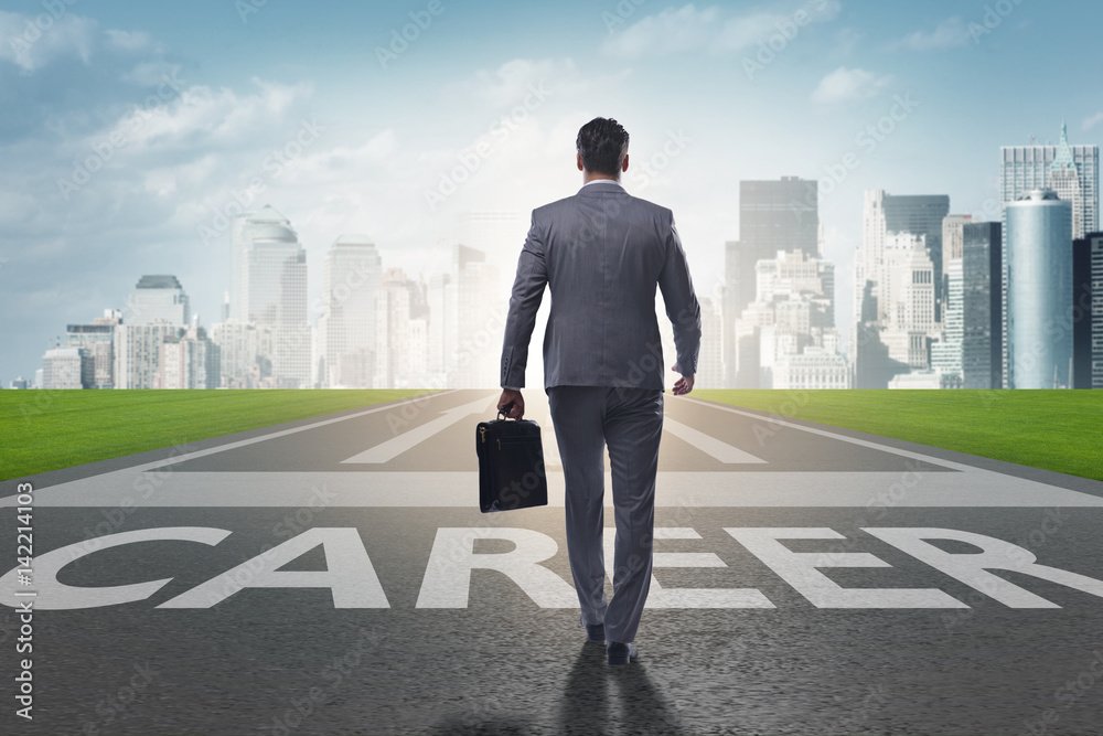 Businessman walking towards his career aspirations Businessman walking towards his career aspirations