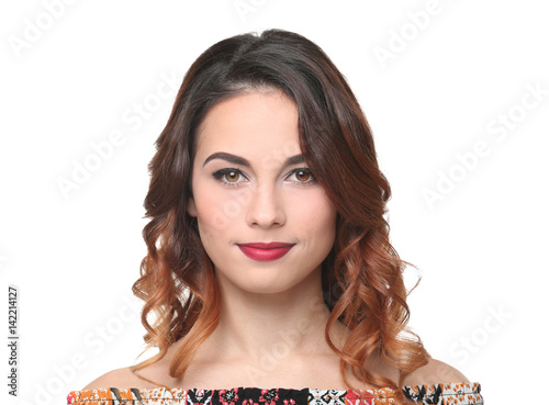 Young beautiful woman with modern hairstyle on white background photo