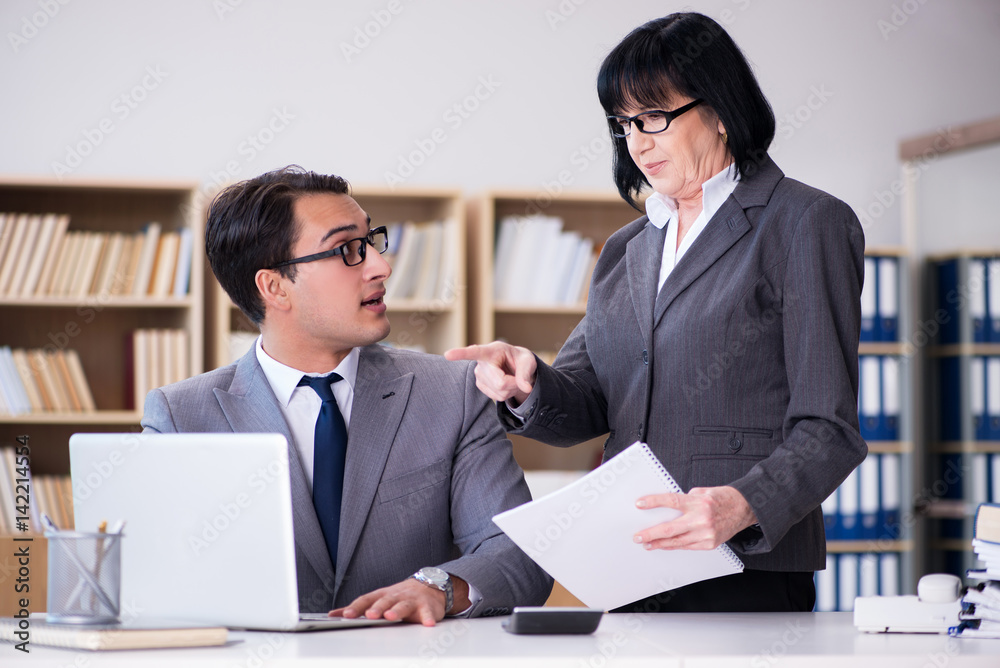 Business couple having discussion in the office Business couple having discussion in the office