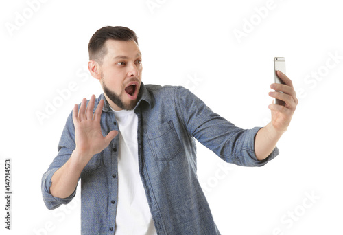 Funny young man taking self...