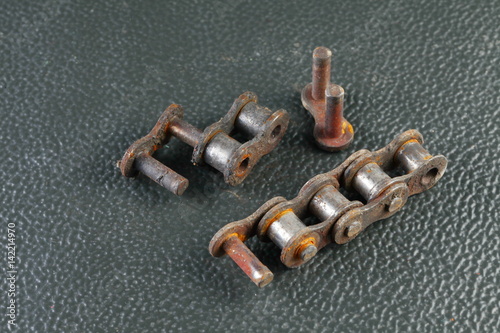The old damaged and dirty metal chain represent the car maintenance concept related idea.