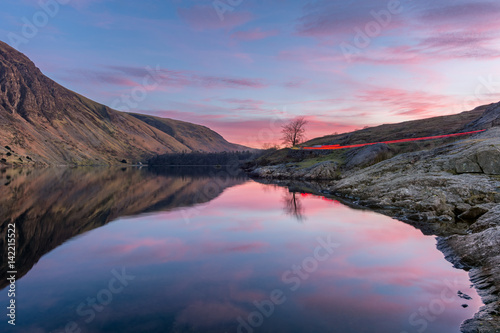 Light Trails with glowing pink and purple sunset at Wast Water in the English Lake District.