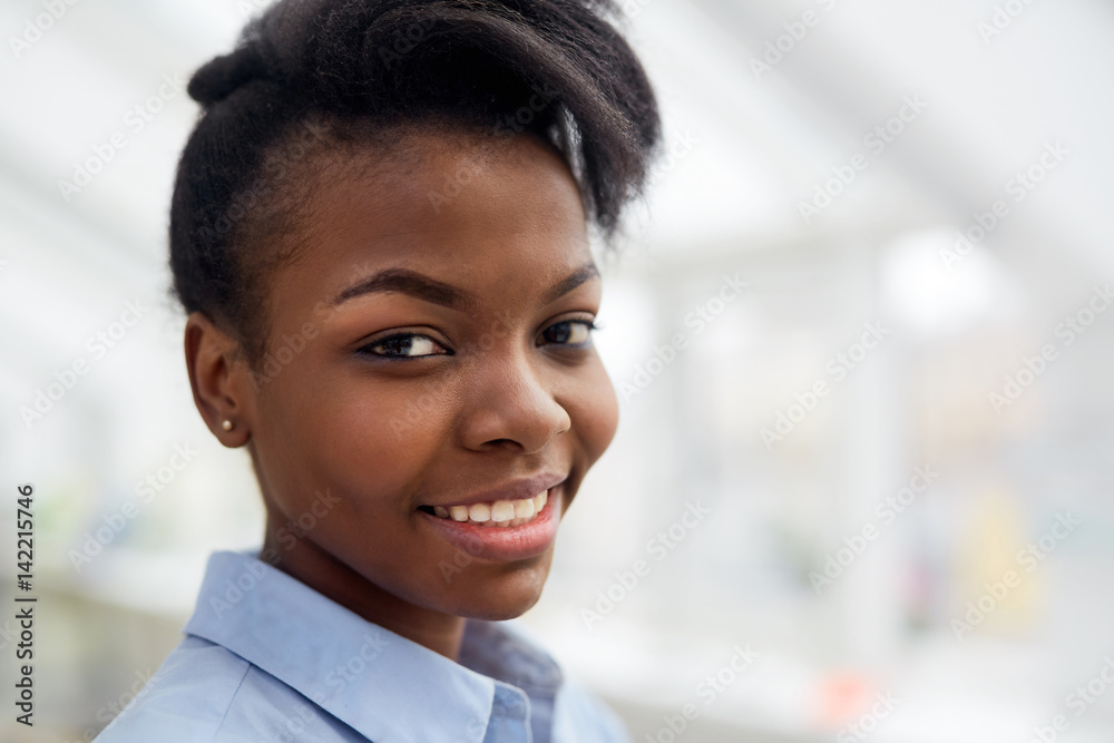 Adolescent girl looking at camera with smile Adolescent girl looking at camera with smile