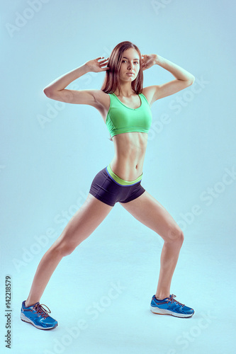 Sports exercises lifestyle, woman in sportswear at gym © vitaliismulskyi