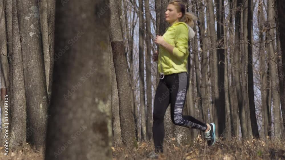 Young woman trail running Young woman trail running