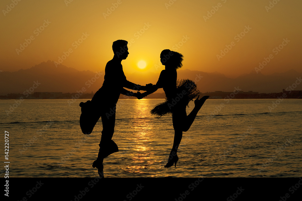 Silhouette couple in the active ballroom dance on sunset Stock Photo ...